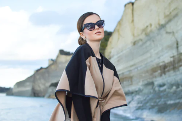 a woman wearing a cape